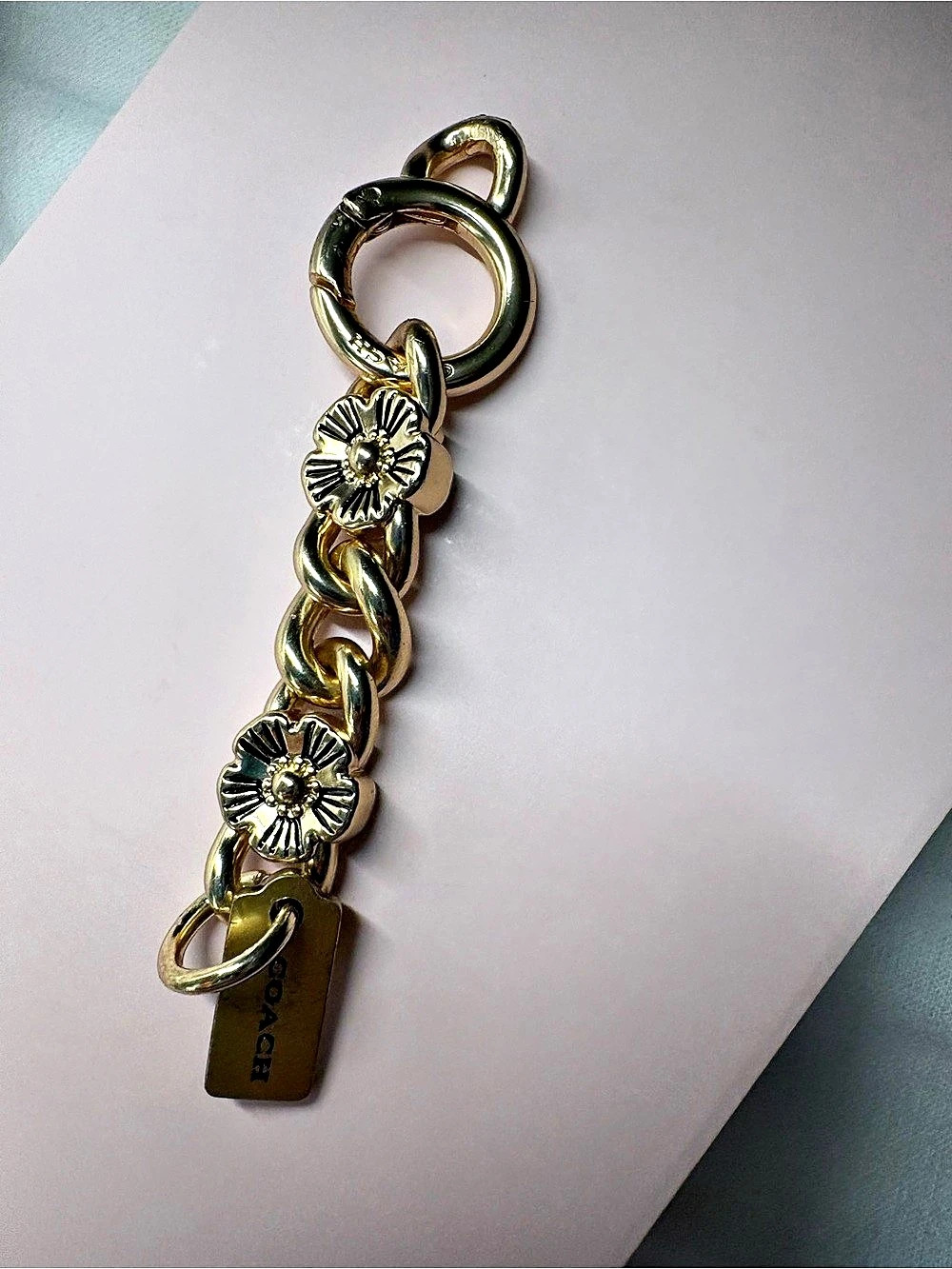 Coach brass tearose chain charm